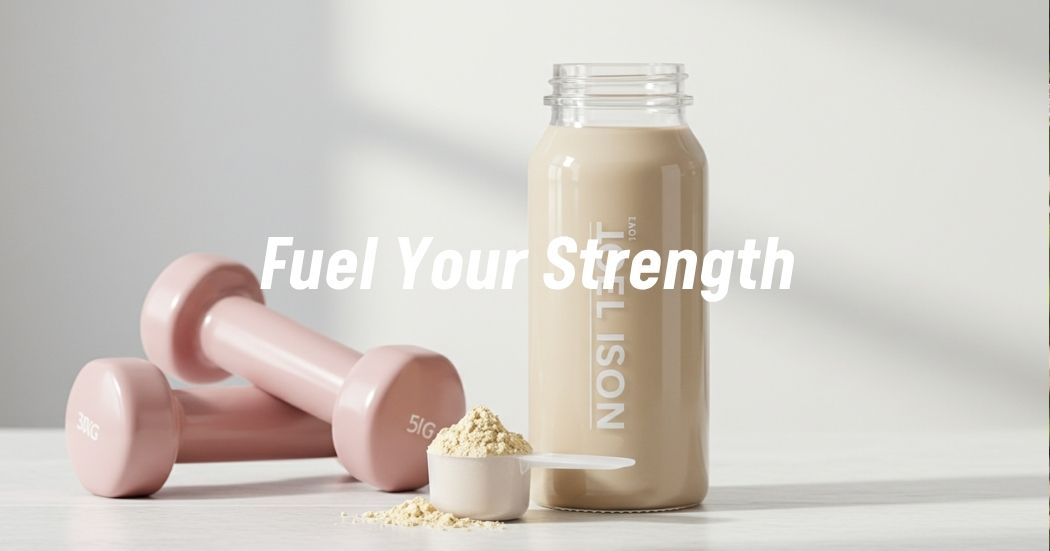 A protein shake with scoop and dumbbells on a kitchen counter symbolizing wellness and strength for women