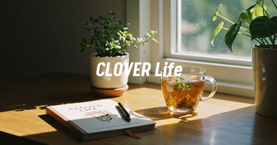 Embrace the CLOVER Lifestyle: Your Guide to a Creative, Vibrant, Empowered & Resilient Life 1 Minimalist workspace with a CLOVER Life journal, herbal tea, and potted plant by a sunlit window